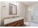 Updated bathroom featuring a granite countertop vanity and a shower and tub combination at 404 Ridgefield Dr, Peachtree City, GA 30269