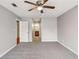 Bedroom view with gray carpet and en-suite bathroom at 404 Ridgefield Dr, Peachtree City, GA 30269