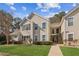 Attractive townhome with well-kept lawn and inviting stairway to the front door at 404 Ridgefield Dr, Peachtree City, GA 30269