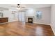 Light-filled living area with hardwood floors, fireplace, and access to outdoor space at 404 Ridgefield Dr, Peachtree City, GA 30269