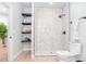 Modern bathroom showcasing a stand-up shower with black fixtures and a set of wall mounted shelves at 4834 Neal Rdg, Atlanta, GA 30349