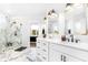 Elegant bathroom featuring marble counters, dual mirrors and glass shower at 4834 Neal Rdg, Atlanta, GA 30349