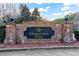 Welcoming brick entrance sign for Champions Park, offering a glimpse of the beautiful community within at 4834 Neal Rdg, Atlanta, GA 30349