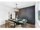 Formal dining room with a large table, a modern chandelier, and dark hardwood floors at 4834 Neal Rdg, Atlanta, GA 30349