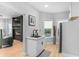 Bright kitchen with stainless steel appliances, sink and a view to the living room at 4834 Neal Rdg, Atlanta, GA 30349