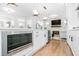 Modern kitchen featuring stainless steel appliances, white cabinets, and hardwood floors at 4834 Neal Rdg, Atlanta, GA 30349