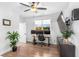 Bright home office with hardwood floors, large window, and a sleek desk setup for productivity at 4834 Neal Rdg, Atlanta, GA 30349