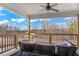 Covered outdoor porch with comfortable seating, a ceiling fan, and a scenic view at 4834 Neal Rdg, Atlanta, GA 30349