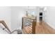 Modern staircase with wood and black metal accents, and natural light at 4834 Neal Rdg, Atlanta, GA 30349