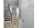 Welcoming entryway with tiled floors and staircase leading to the upper level at 5735 Hedge Brook Dr, Cumming, GA 30028