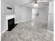 Cozy living room featuring a fireplace and luxury vinyl tile flooring at 5735 Hedge Brook Dr, Cumming, GA 30028