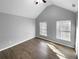 Spacious bedroom with wood floors, vaulted ceiling, and ample natural light at 5735 Hedge Brook Dr, Cumming, GA 30028