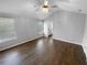 Spacious main bedroom with a vaulted ceiling, ceiling fan, and hardwood floors at 5735 Hedge Brook Dr, Cumming, GA 30028