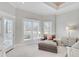 Bedroom with great natural light, with a lounge chair, and decorative windows at 7015 Polo Dr, Cumming, GA 30040