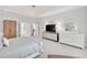 Bright bedroom with a decorative dresser, closet and cozy rug at 7015 Polo Dr, Cumming, GA 30040