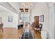 Grand foyer with soaring ceilings, hardwood floors, elegant chandelier, and stairway to the upper level at 7015 Polo Dr, Cumming, GA 30040