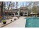 Large backyard featuring an inground pool, a spacious deck, and ample seating areas at 870 Waddington Ct, Atlanta, GA 30350