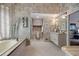 A full bathroom features a soaking tub, separate toilet, and a vanity with decorative wallpaper and tile flooring at 870 Waddington Ct, Atlanta, GA 30350