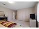 Bright bedroom featuring neutral walls, carpet flooring, and ample closet space for storage at 870 Waddington Ct, Atlanta, GA 30350