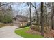 Lovely home featuring stone accents, a side-entry garage, and beautiful landscaping at 870 Waddington Ct, Atlanta, GA 30350