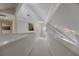 Upstairs hallway bathed in natural light from a large window with crisp, white trim and railings and modern lighting at 870 Waddington Ct, Atlanta, GA 30350