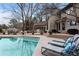 Inviting pool with an entertainment deck and lounge chairs, perfect for summer relaxation at 870 Waddington Ct, Atlanta, GA 30350