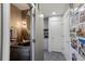 Stylish powder room with decorative wallpaper, an ornate mirror, and vessel sink at 870 Waddington Ct, Atlanta, GA 30350