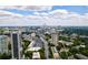 Stunning aerial view of the cityscape, featuring high-rise buildings set against a backdrop of lush greenery and blue skies at 91 Rumson Ne Rd # C34, Atlanta, GA 30305