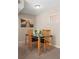 Cozy dining area with black table and wooden chairs, next to a bright window at 91 Rumson Ne Rd # C34, Atlanta, GA 30305