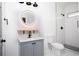 Contemporary bathroom with a walk-in shower, modern fixtures, and a sleek vanity, maximizing space and style at 994 Byron Sw Dr, Atlanta, GA 30310