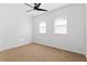 Bright bedroom with neutral walls, carpet, and ceiling fan at 994 Byron Sw Dr, Atlanta, GA 30310