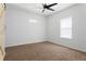 Bright bedroom with neutral walls, carpet, and ceiling fan at 994 Byron Sw Dr, Atlanta, GA 30310