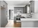 Well-appointed kitchen with stainless steel appliances, subway tile backsplash, and access to the backyard at 994 Byron Sw Dr, Atlanta, GA 30310