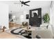 Inviting living room with a cozy atmosphere, complemented by stylish decor and a view into the dining area at 994 Byron Sw Dr, Atlanta, GA 30310