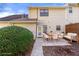 Backyard view with a patio featuring an outdoor dining area and nice landscaping at 1175 Jamestowne Trl, Alpharetta, GA 30009