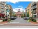 Charming street view with tree-lined sidewalks, brick buildings, and a central landmark building at 1175 Jamestowne Trl, Alpharetta, GA 30009