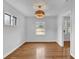 Bright dining room featuring hardwood floors and a modern light fixture at 2880 Hall Se Dr, Smyrna, GA 30082