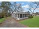 Charming home featuring a screened-in porch and mature trees at 2880 Hall Se Dr, Smyrna, GA 30082