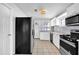 Kitchen featuring stainless steel appliances, white cabinets, and a tile backsplash at 2880 Hall Se Dr, Smyrna, GA 30082