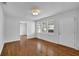 Bright living room showcasing hardwood floors, white walls, and natural light streaming through the windows at 2880 Hall Se Dr, Smyrna, GA 30082