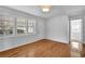 Bright living room featuring hardwood floors, white walls, and large windows at 2880 Hall Se Dr, Smyrna, GA 30082