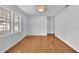 Bright living room featuring hardwood floors, white walls, and large windows at 2880 Hall Se Dr, Smyrna, GA 30082