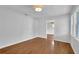 Bright living room featuring hardwood floors, white walls, and large windows at 2880 Hall Se Dr, Smyrna, GA 30082