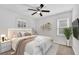 Staged bedroom with large bed, side table, indoor plant, and wall decorations that make it feel like home at 2880 Hall Se Dr, Smyrna, GA 30082