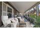 Inviting screened porch furnished with seating and plants, offering a relaxing outdoor space at 2880 Hall Se Dr, Smyrna, GA 30082