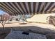Backyard patio with striped awning, manicured landscaping and pavers at 312 Overview Dr, Canton, GA 30114