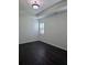 A calm bedroom with tray ceiling, modern window shutters, and dark floors at 312 Overview Dr, Canton, GA 30114