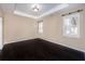 Spacious bedroom with dark wood floors, tray ceiling, neutral walls and window shutters at 312 Overview Dr, Canton, GA 30114