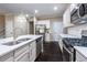 Beautiful kitchen with white cabinets, stainless steel appliances, a center island, and modern pendant lighting at 312 Overview Dr, Canton, GA 30114