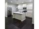 Bright kitchen with white cabinets, stainless steel appliances, and large center island, great for modern living at 312 Overview Dr, Canton, GA 30114